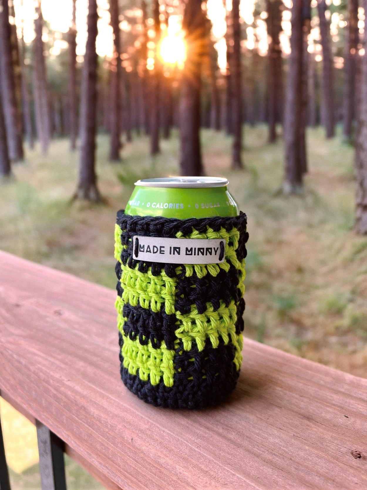 black and lime green crocheted can coozie